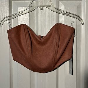 A salmon color crop top. Size S (but was too big to fit my chest area).